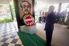 U.S. Secretary of State John Kerry laying a wreath at the founder's house in Dhaka, Bangladesh