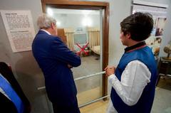 U.S. Secretary of State John Kerry looks at bedroom where family was herded and killed in Dhaka, Bangladesh