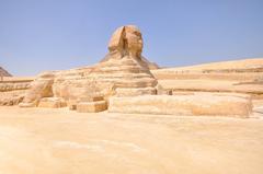 The Great Sphinx of Giza, a large limestone statue with a lion's body and a human head, missing its nose and beard. Located on the Giza Plateau in Egypt.