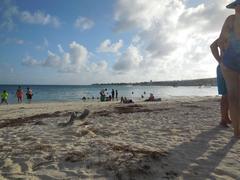 Beach on North side of island with clear sky and calm water