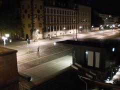 Mainkai in Frankfurt at night from Eiserner Steg with almost empty promenade