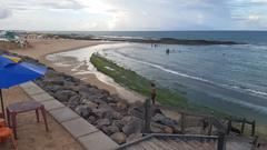 Praia do Meio beach in Natal, Brazil with clear blue skies and calm ocean waves