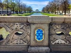 Invader tile on a bridge in front of Nymphenburg Palace in Munich