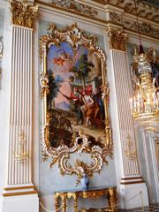 a room in Nymphenburg Palace with antique furnishings