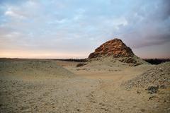 The pyramid of Sahure at sunset with Giza pyramids in the background