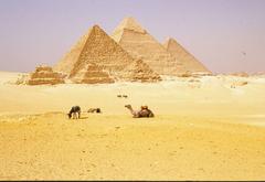 Pyramids of Giza under a clear blue sky