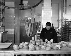 baker making bread bowls