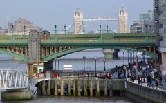 Bankside Jetty and Southwark Bridge over the River Thames with Tower Bridge in London