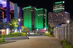 night view of Place-des-Arts and green-lit buildings in Complexe Desjardins