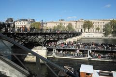 Pont des Arts with Bateaux Parisiens boat in Paris