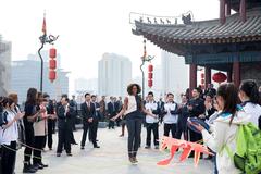 Michelle Obama jumps rope with children at the City Wall in Xi'an, China