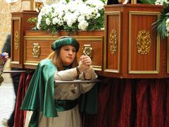 Holy Week procession in Palma's Plaça de Cort featuring the Confraternity of the Christ of Santa Creu