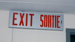 Bilingual exit sign in English and French at CN Tower in Toronto