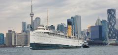 SS Keewatin towed by tug boat