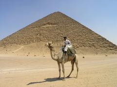 Tourist policemen on camel near Red Pyramid in Dahshur