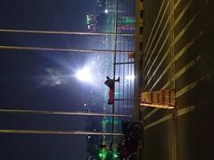 A tired man rests on a bridge in Hatir Jheel, Dhaka, Bangladesh