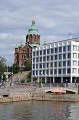 Helsinki cityscape with waterfront buildings and boats