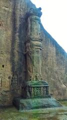 Buddhist temple pillar with sculptures in Kanheri, Mumbai