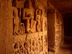 ancient cave carvings on a stone wall