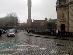 Climate rally begins at Porte de Paris with town hall belfry in view, Lille