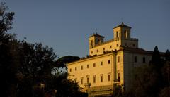 view from the top of the Spanish Steps of a building catching the evening sun