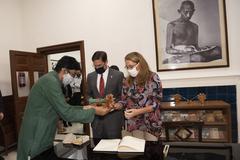 Defense Secretary Mark Esper and Leah Esper receiving gifts at the Gandhi Smriti museum