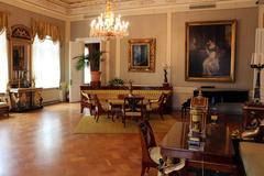 Interior of Sinebrychoff Art Museum's Empire Hall with classical paintings and elegant furnishings