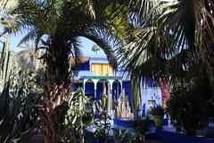 Jardin Majorelle lush garden with vibrant blue building and tropical plants