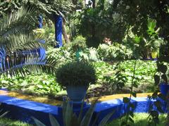 Jardin de Majorelle in Marrakech with vibrant blue buildings and lush greenery