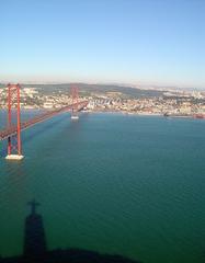 Panoramic view of Lisbon featuring red rooftops and historic buildings