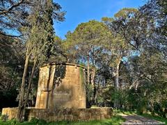 Old windmills amidst dense forest in Monsanto Forest Park, Lisbon