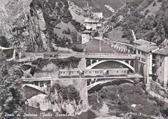 Sedrina bridges spanning a valley with lush greenery