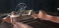 Interior view of the London Mithraeum with historical artifacts and modern lighting