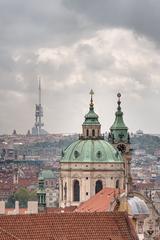 Dome and Tower of St. Nicholas Church with Žižkov TV tower in the background, Prague, Czech Republic