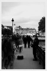 black and white photo of an accordionist performing in Paris