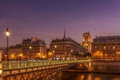 Paris cityscape at night with illuminated Eiffel Tower