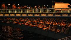 Pont d'Arcole illuminated at night in Paris