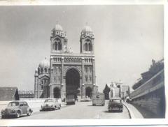 Vintage cars parked near historical building