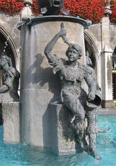 Fischbrunnen in München detail with butcher journeyman emptying water bucket