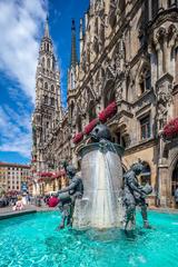 Fischbrunnen and New Town Hall in Munich with a human figure