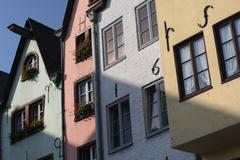 Fischmarkt in Cologne with colorful buildings and the Great St. Martin Church in the background