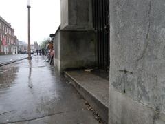 Bench Mark on Fitzwilliam Museum perimeter wall