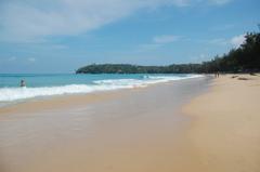 Kata Beach in Thailand with clear blue waters and a sandy shore