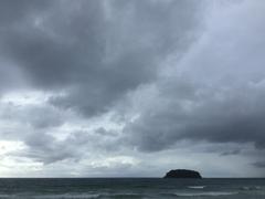 Kata Beach ocean view under overcast sky in Phuket, Thailand