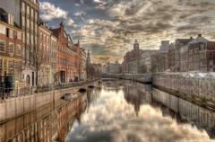 canal in Amsterdam with historic buildings and boats