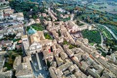 Assisi town view with historical buildings and dramatic sky