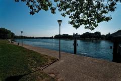 Panoramic view from the Rhône river bank featuring Pont Saint Bénézet, Avignon Cathedral, Palais des Papes, and Pont Édouard Daladier