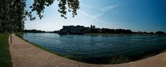 Panorama of Pont Saint Bénézet, Jardin des doms, Avignon Cathedral, Palais des Papes and Ramparts from Rhône river bank