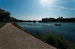 View of Pont Saint Bénézet, Jardin des Doms, Avignon Cathedral, and Palais des Papes from Rhône river bank