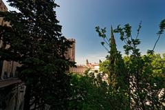 Steps leading up to Avignon Cathedral with a view towards the Clock tower of Avignon Town Hall